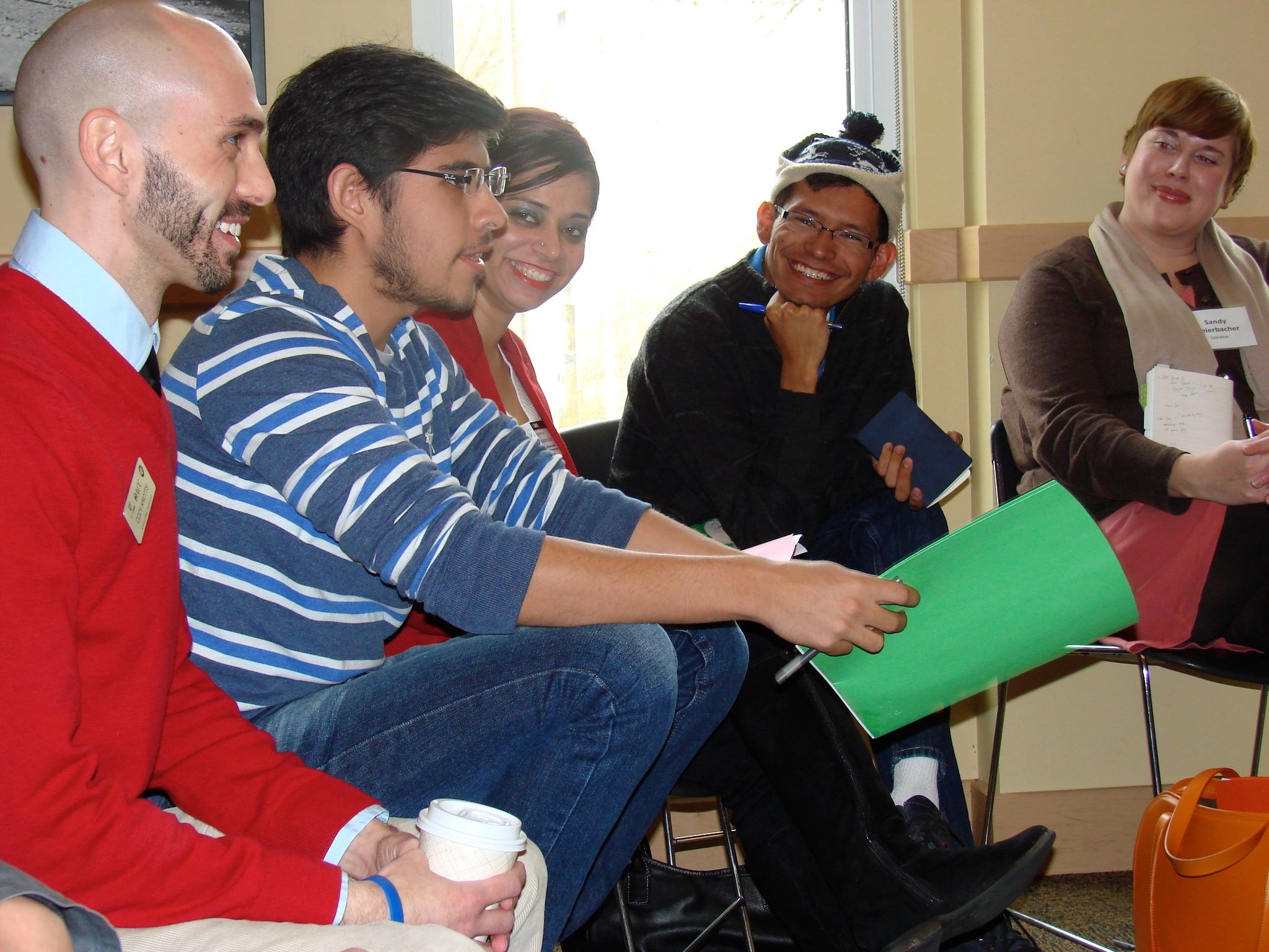 An image of dialogue participants listen to one participant who is speaking.